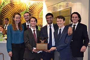 capstone team poses with winning cup