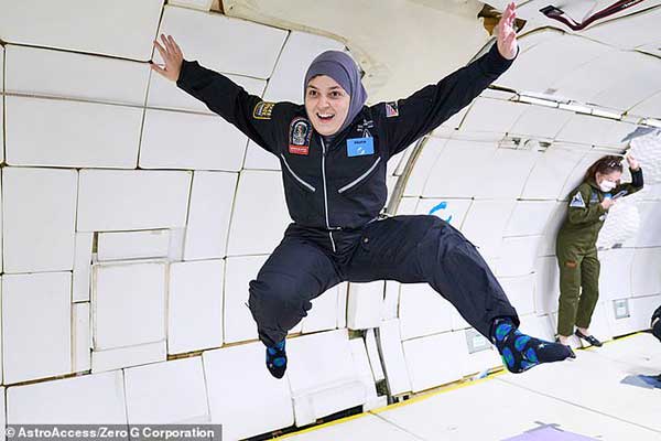 Mona Minkara floats weightless in zero gravity experience.