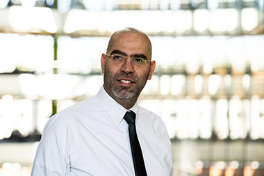 Saeed Amal headshot with a blurred background